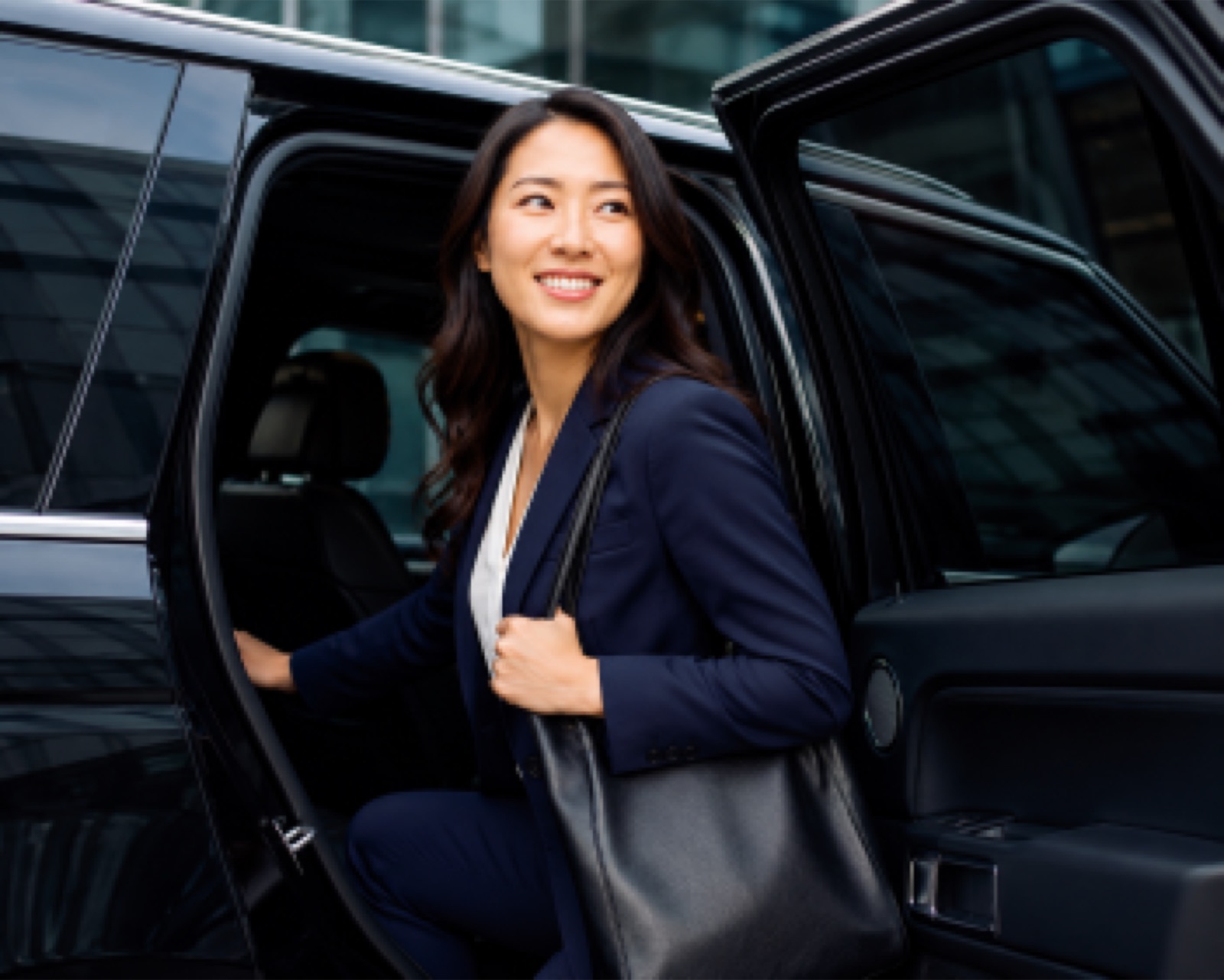 A business traveller stepping out of an Orbit car