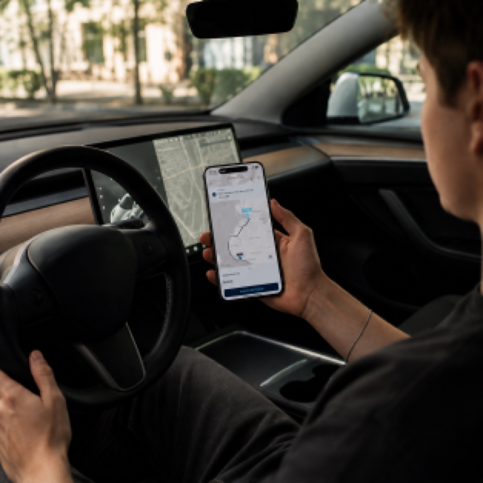 An Orbit driver checking the route on the Orbit app